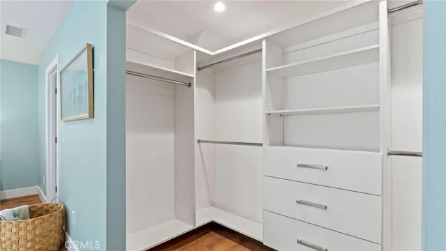 a view of an empty walk in closet