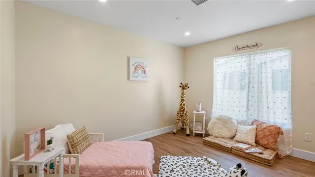 a bedroom with furniture and a window