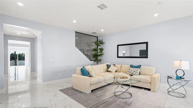 a living room with furniture and a couch