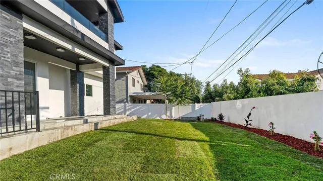a view of a terrace with a garden and plants