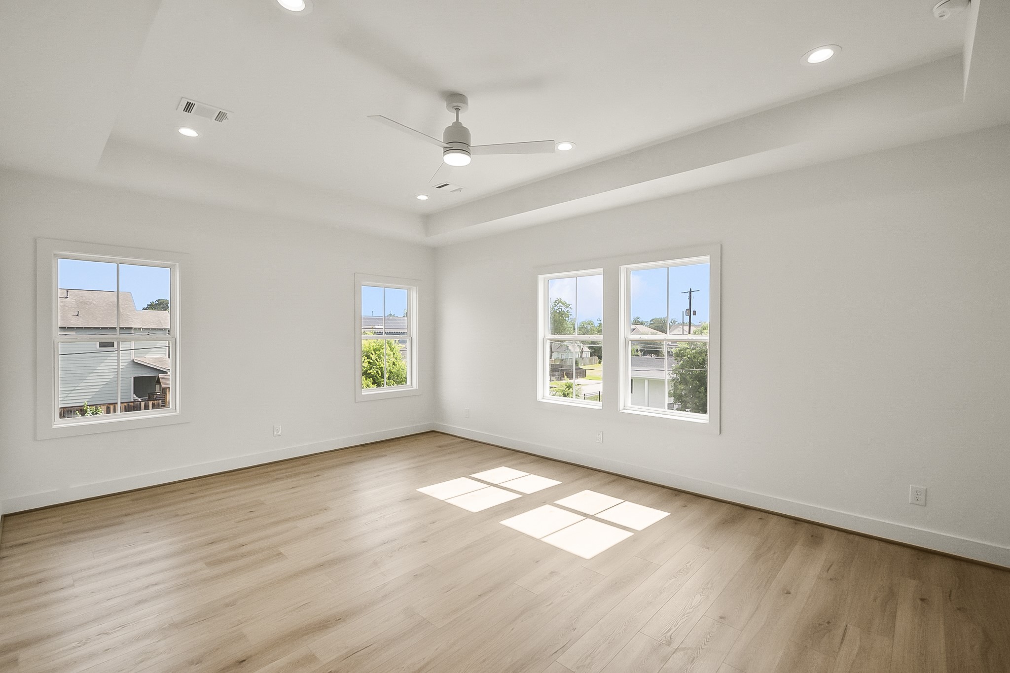 1109 Tabor Street Houston, TX 77009 - Photo 28 of 38 a view of an empty room with wooden floor and a window