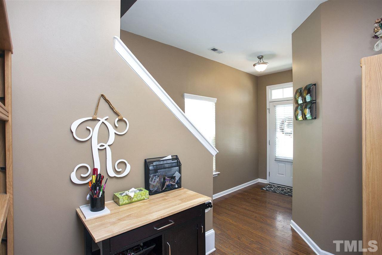 645 Smith Ridge Way Fuquay-Varina, NC 27526 - Photo 3 of 25 The hardwoods are just beautiful and the unique configuration of the hallway adds a nice architectural touch as you enter the home.