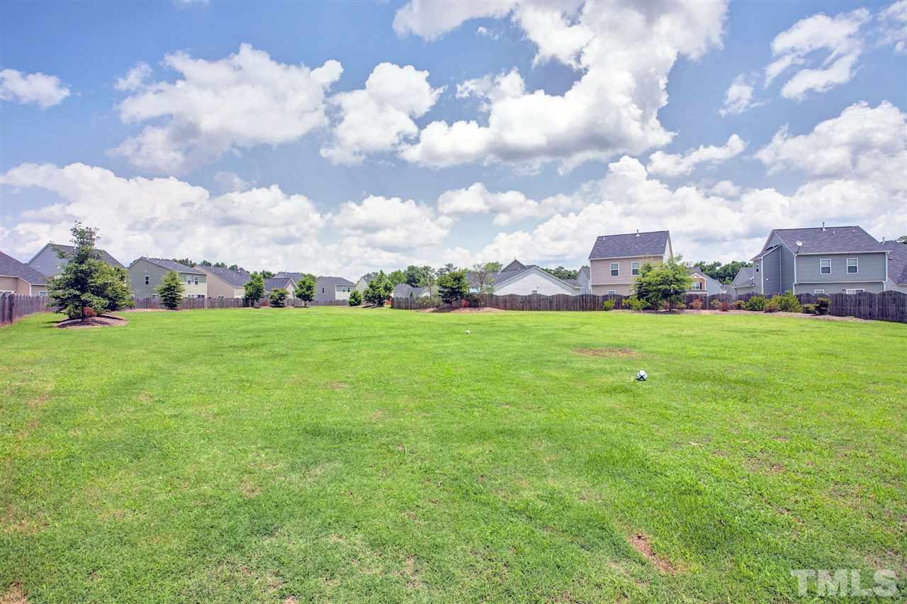 645 Smith Ridge Way Fuquay-Varina, NC 27526 - Photo 24 of 25 The yard backs up to the common area park for the community - the fence has a convenient gate for easy access to this great space!