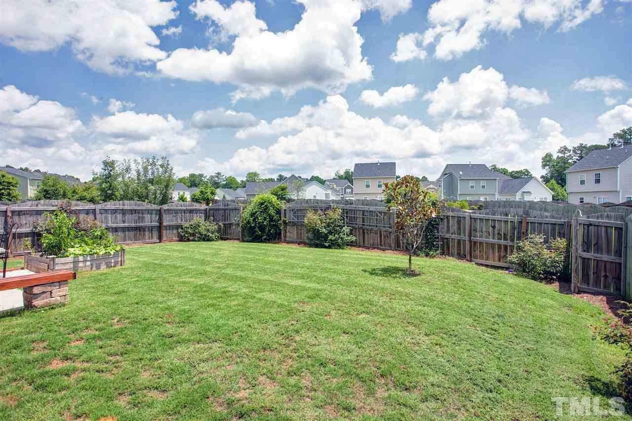645 Smith Ridge Way Fuquay-Varina, NC 27526 - Photo 25 of 25 The owners already started a wonderful above ground garden - lots a room to run around in - or just enjoy the patio grilling out dinner ....