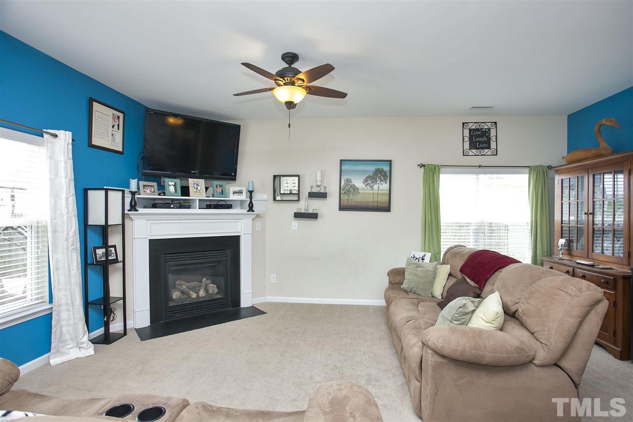 645 Smith Ridge Way Fuquay-Varina, NC 27526 - Photo 7 of 25 Can we just say "Inviting"! The corner fireplace is cozy in the winter and just beautiful to look at in the summer!