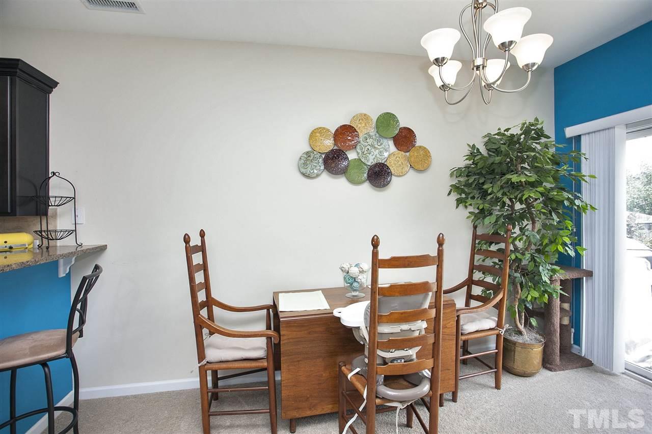 645 Smith Ridge Way Fuquay-Varina, NC 27526 - Photo 10 of 25 Handsome pendant lighting - great view out to the backyard.