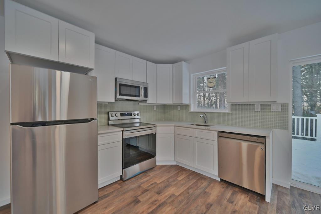 139 Winter Hill Road Effort, PA 18330 - Photo 12 of 50 a kitchen with stainless steel appliances a refrigerator sink and microwave