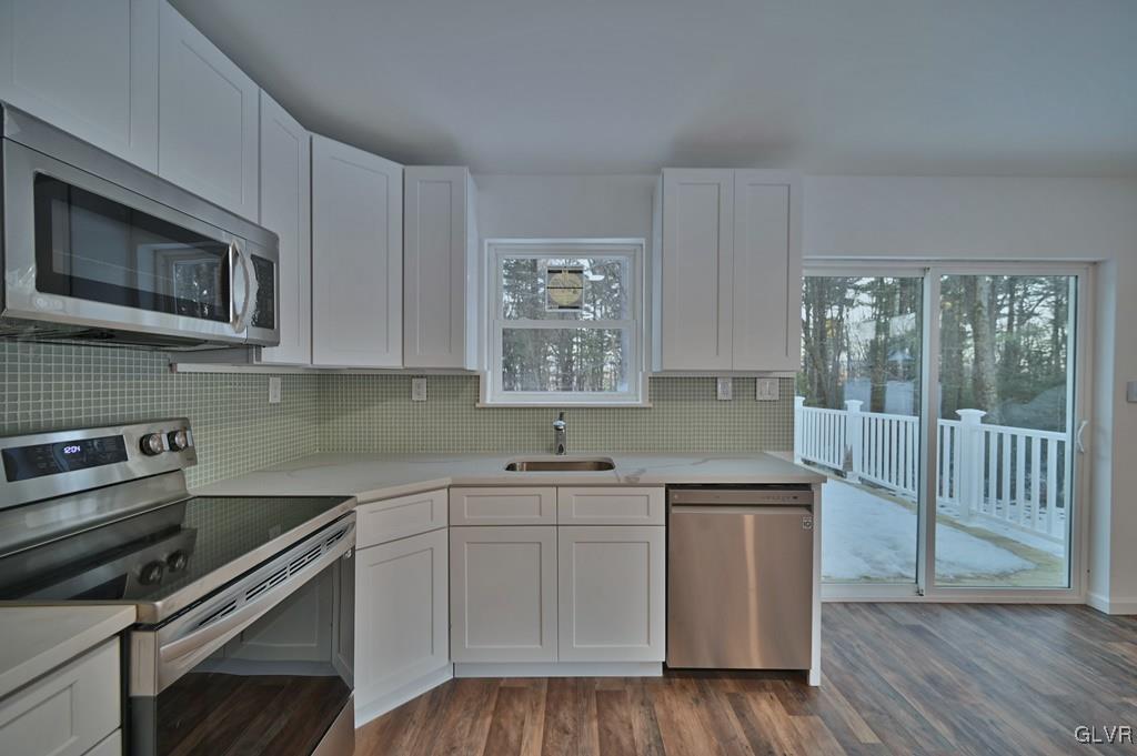 139 Winter Hill Road Effort, PA 18330 - Photo 13 of 50 a kitchen with a sink stove and cabinets