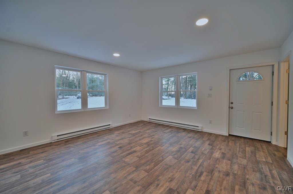 139 Winter Hill Road Effort, PA 18330 - Photo 15 of 50 an empty room with wooden floor and windows