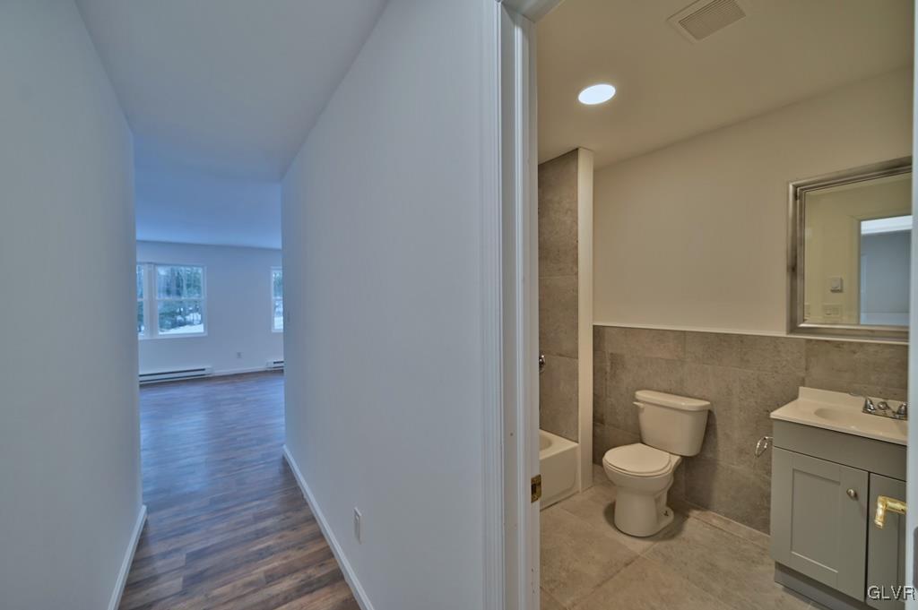 139 Winter Hill Road Effort, PA 18330 - Photo 16 of 50 a bathroom with a toilet a sink and mirror