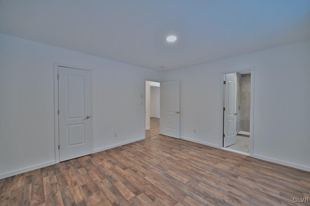 139 Winter Hill Road Effort, PA 18330 - Photo 19 of 50 a view of an empty room with wooden floor
