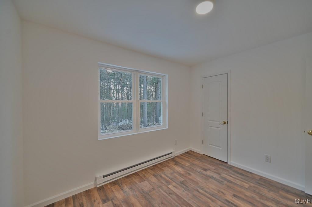 139 Winter Hill Road Effort, PA 18330 - Photo 25 of 50 a view of an empty room with wooden floor and a window