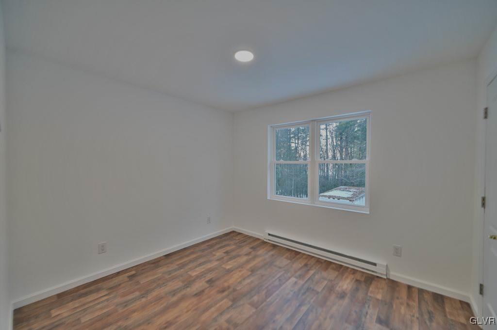 139 Winter Hill Road Effort, PA 18330 - Photo 27 of 50 an empty room with wooden floor and windows