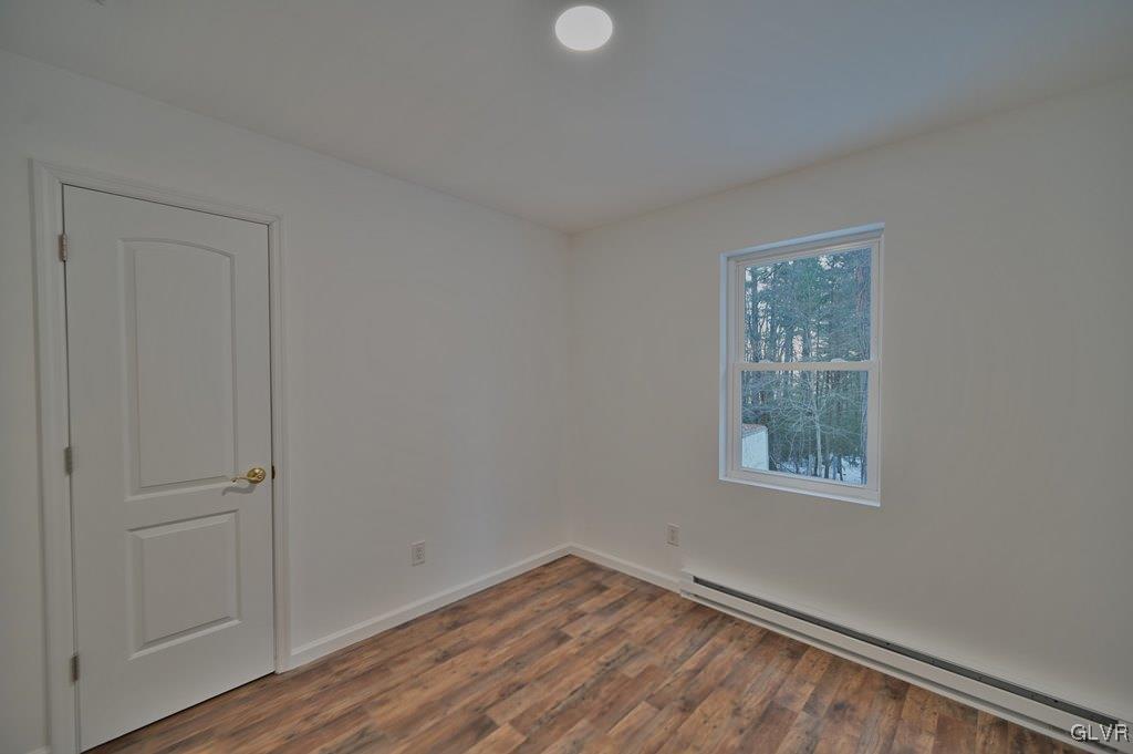 139 Winter Hill Road Effort, PA 18330 - Photo 29 of 50 a view of an empty room with wooden floor and a window