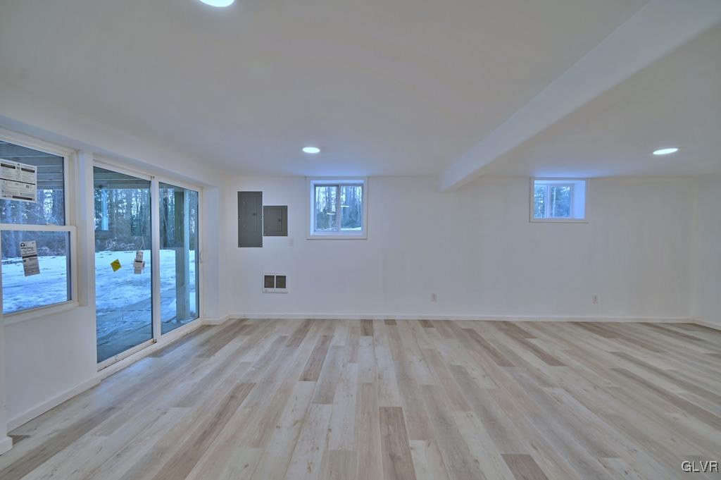 139 Winter Hill Road Effort, PA 18330 - Photo 36 of 50 a view of an empty room with wooden floor and a window