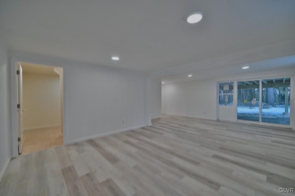 139 Winter Hill Road Effort, PA 18330 - Photo 38 of 50 an empty room with wooden floor and windows