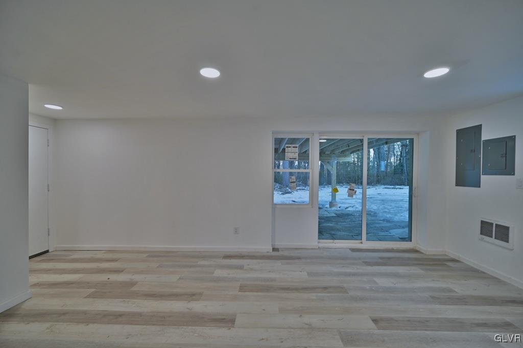 139 Winter Hill Road Effort, PA 18330 - Photo 42 of 50 a view of an empty room with wooden floor and a window