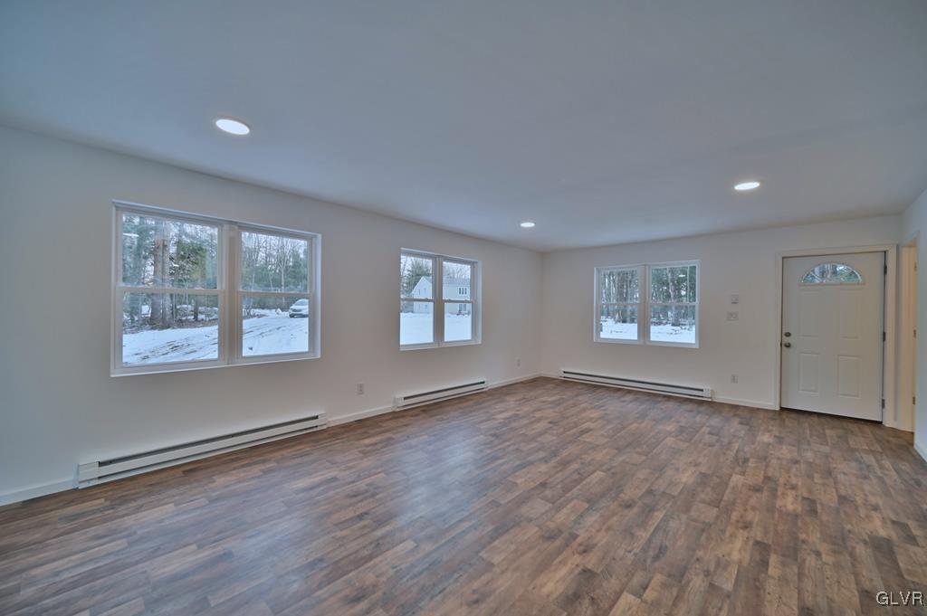 139 Winter Hill Road Effort, PA 18330 - Photo 6 of 50 an empty room with wooden floor and windows