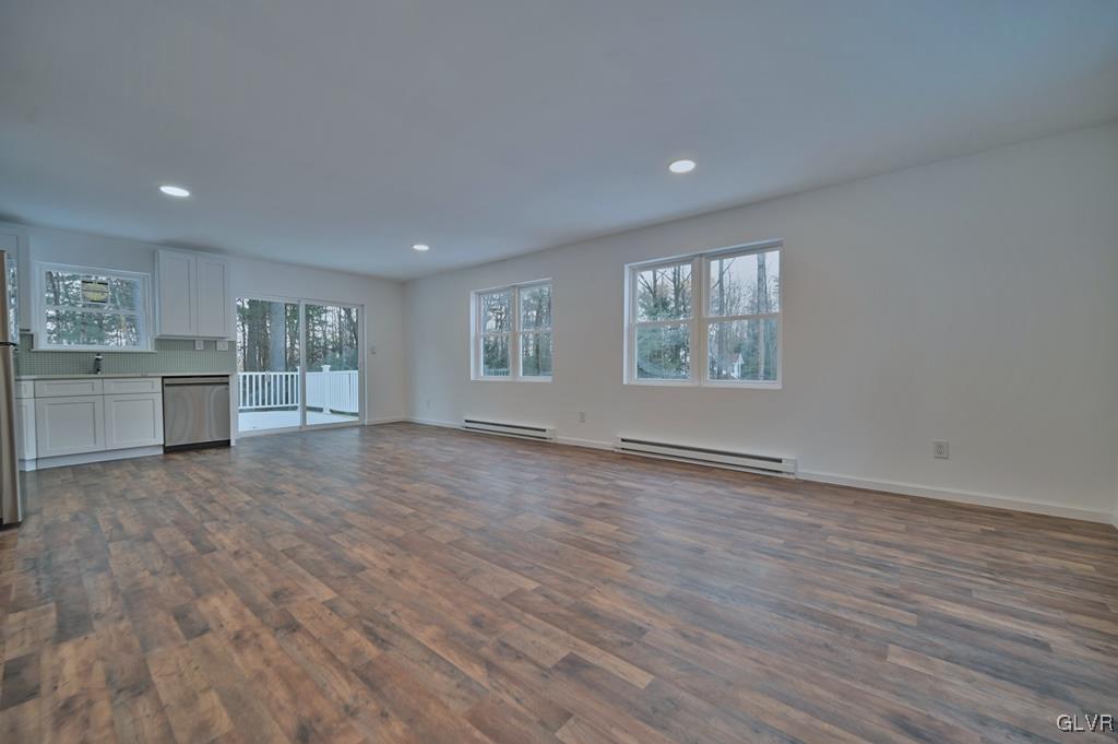 139 Winter Hill Road Effort, PA 18330 - Photo 7 of 50 a view of an empty room with a window and wooden floor