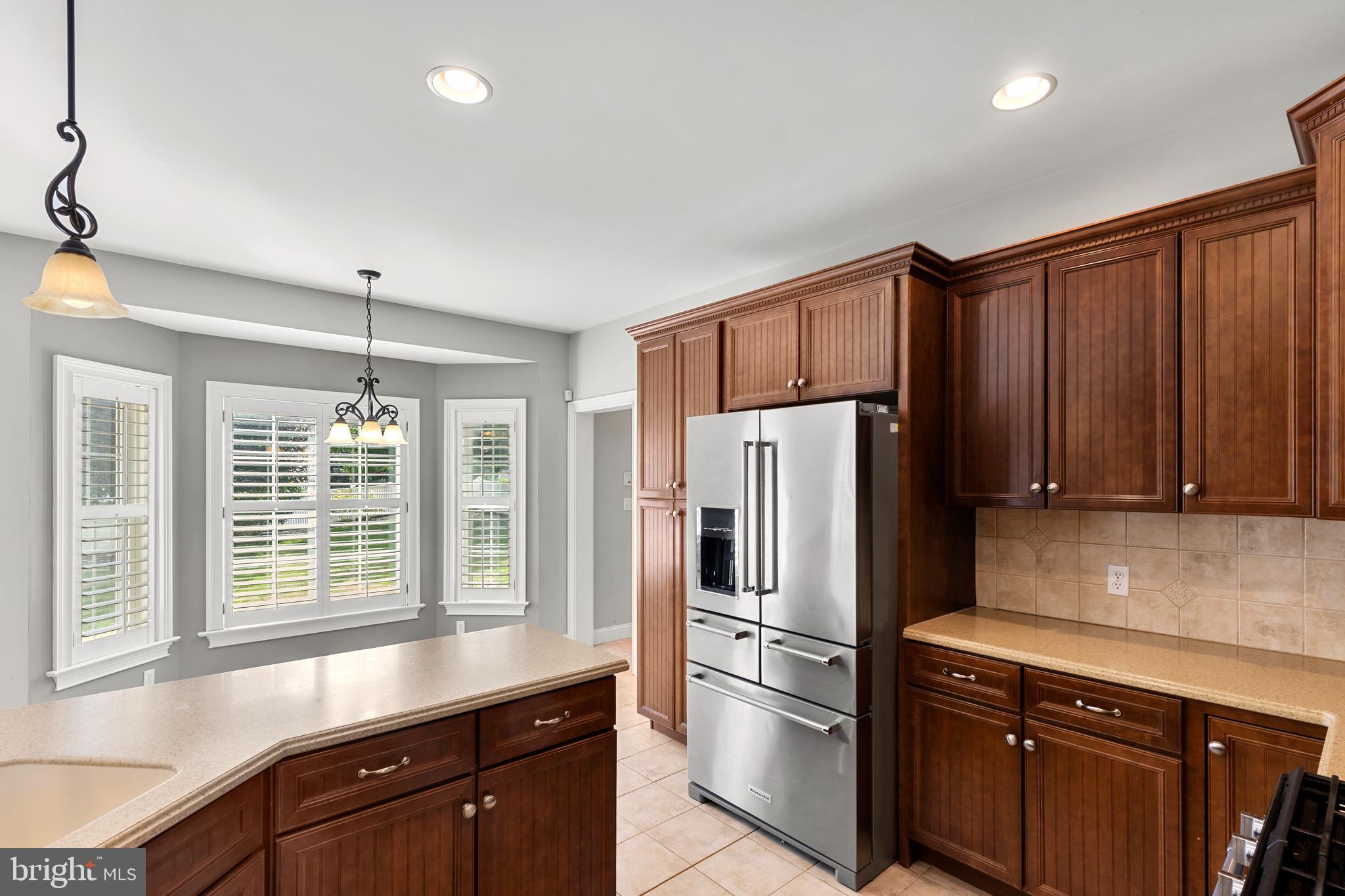 2717 Kreider Road Lititz, PA 17543 - Photo 12 of 33 a kitchen with granite countertop stainless steel appliances a refrigerator cabinets and a sink