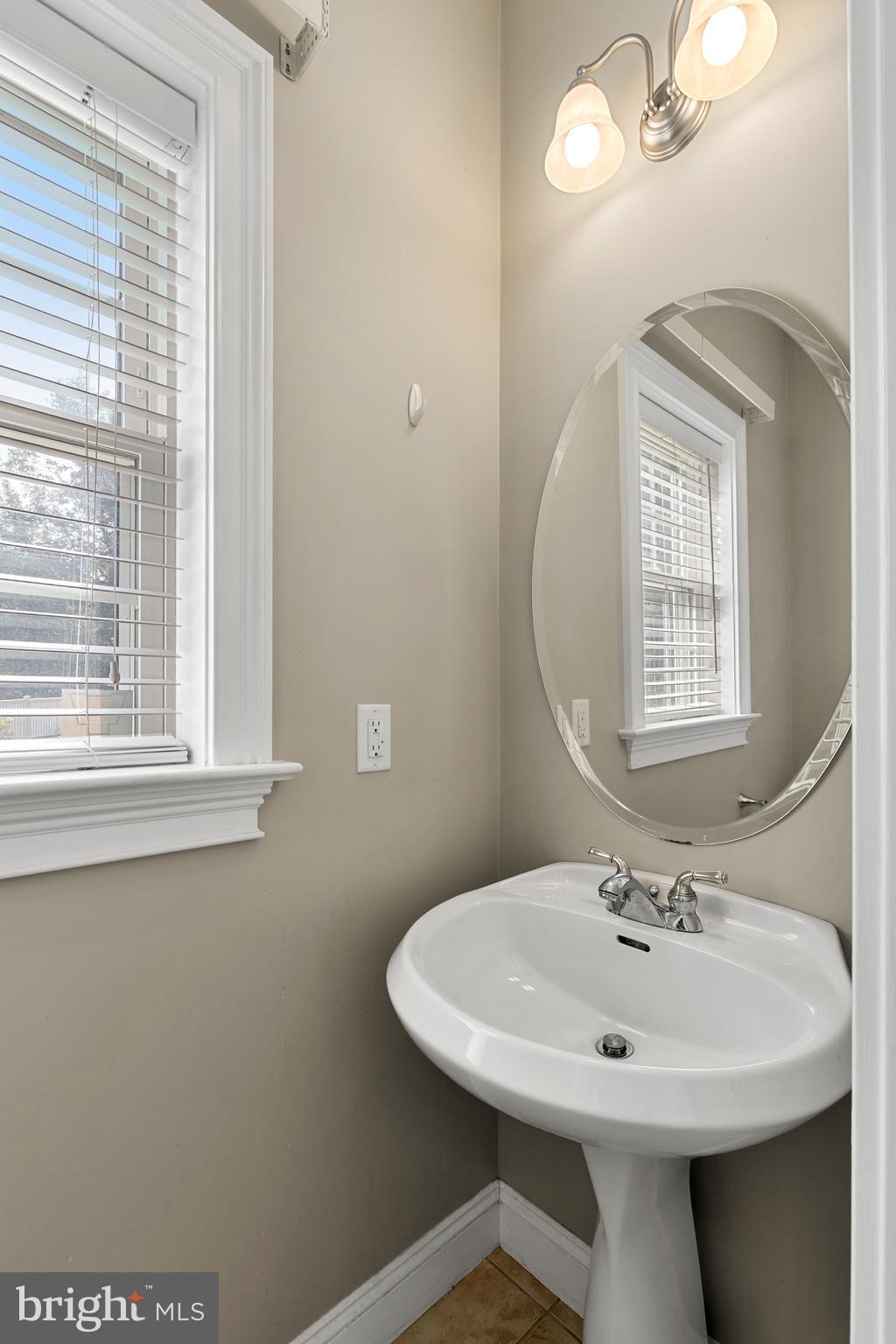 2717 Kreider Road Lititz, PA 17543 - Photo 15 of 33 a bathroom with a sink and a mirror