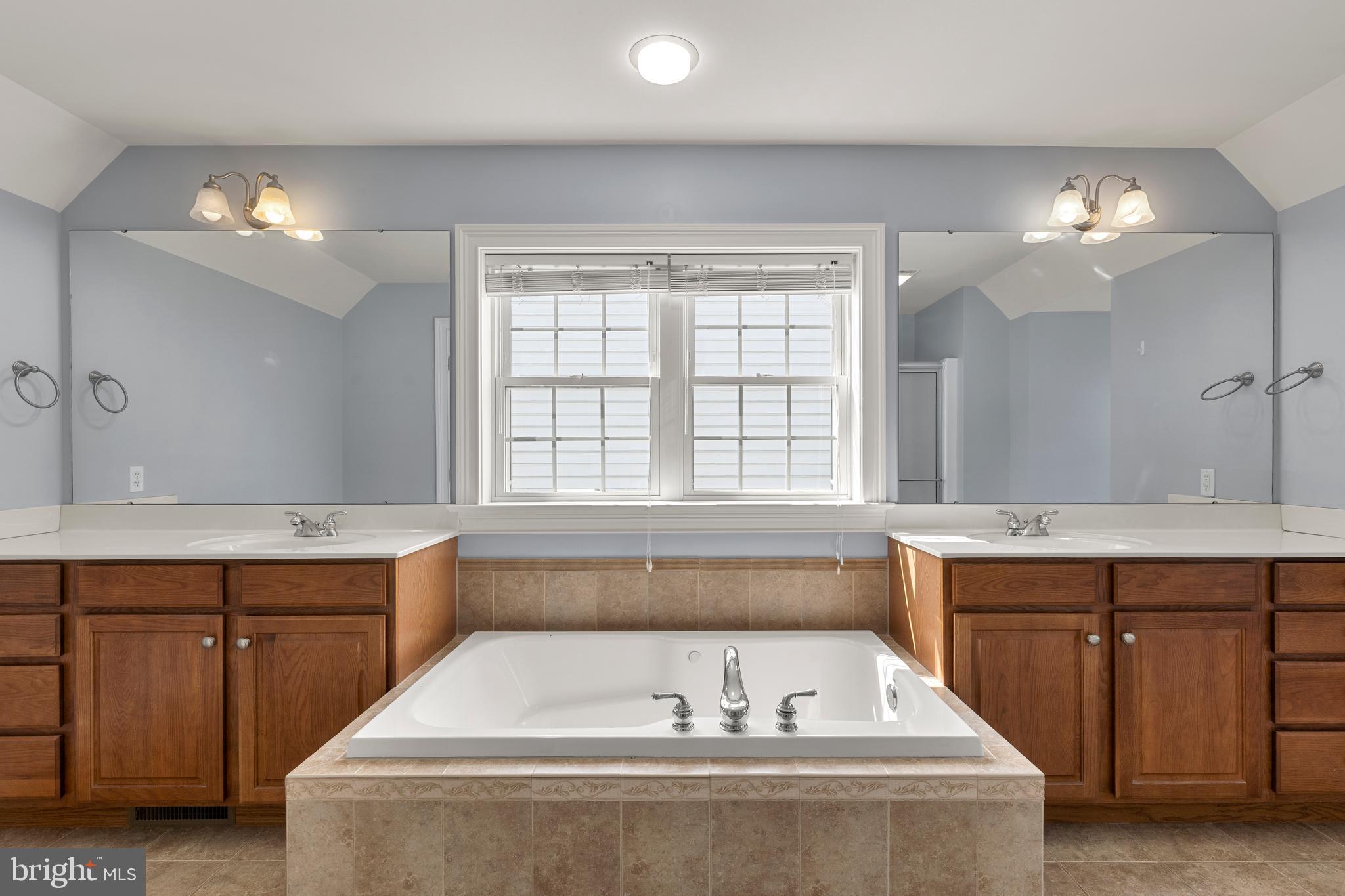 2717 Kreider Road Lititz, PA 17543 - Photo 20 of 33 a spacious bathroom with a tub double sink and window