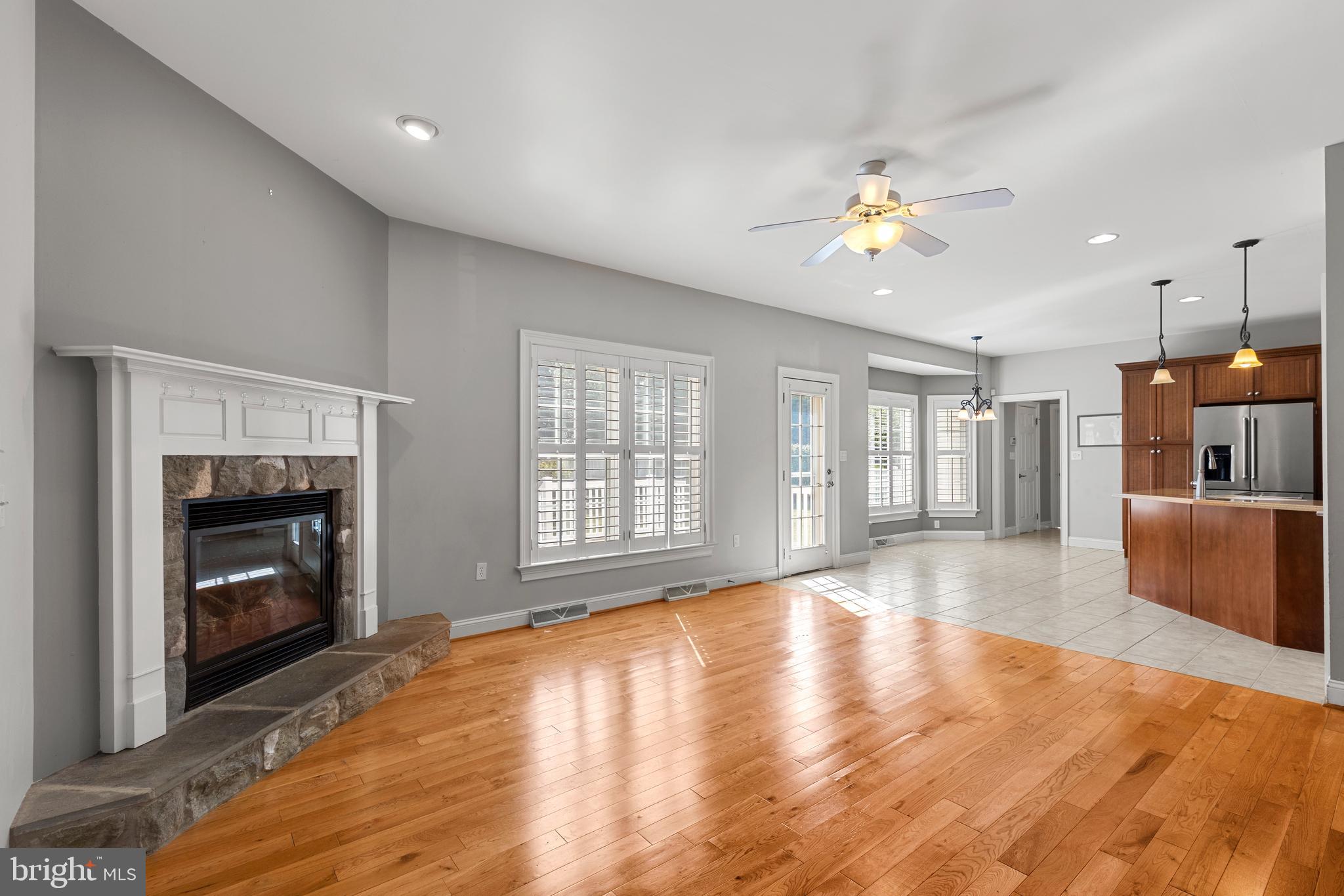 2717 Kreider Road Lititz, PA 17543 - Photo 7 of 33 a view of an empty room with a fireplace and a window