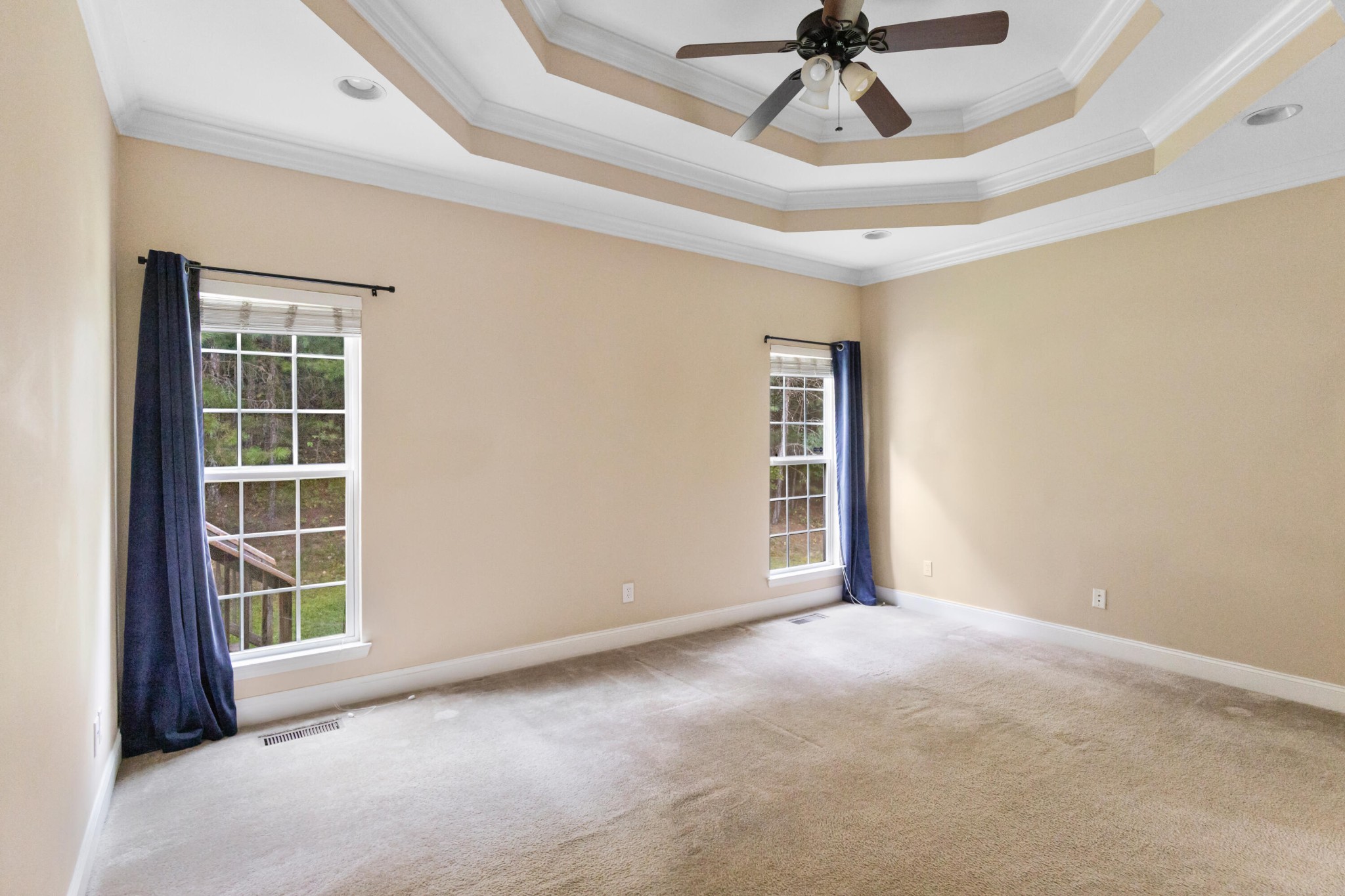 2095 Baggett Road Ringgold, GA 30736 - Photo 11 of 34 an empty room with windows and ceiling fan