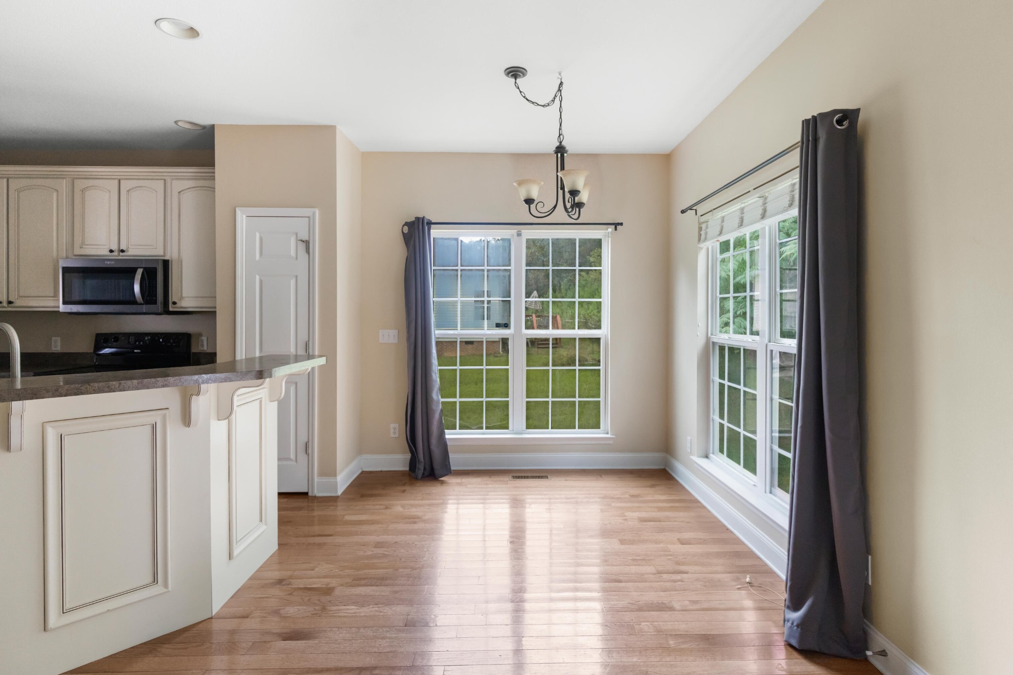2095 Baggett Road Ringgold, GA 30736 - Photo 18 of 34 a view of an empty room with a window and wooden floor