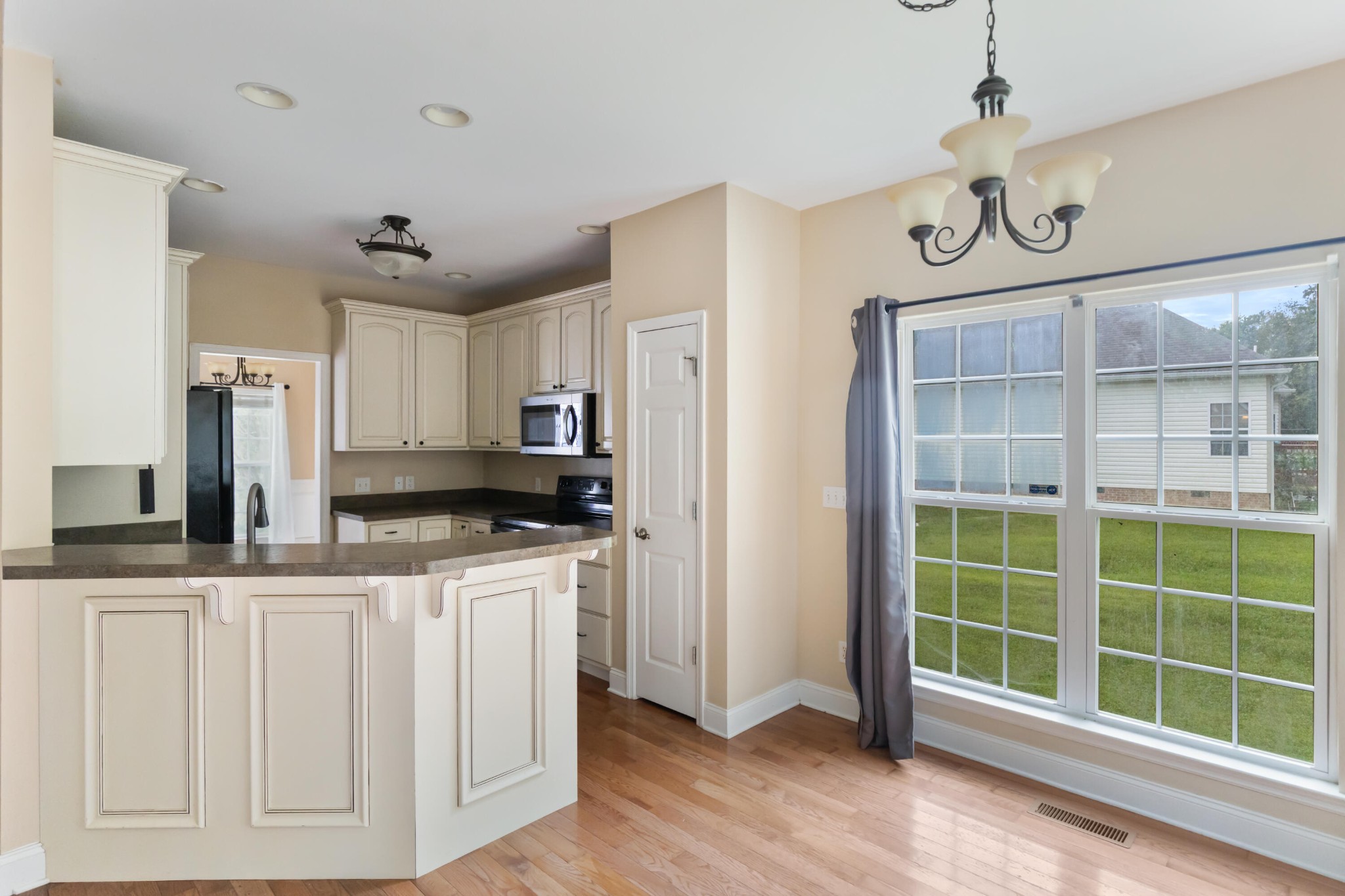 2095 Baggett Road Ringgold, GA 30736 - Photo 19 of 34 a kitchen with stainless steel appliances granite countertop a sink and cabinets