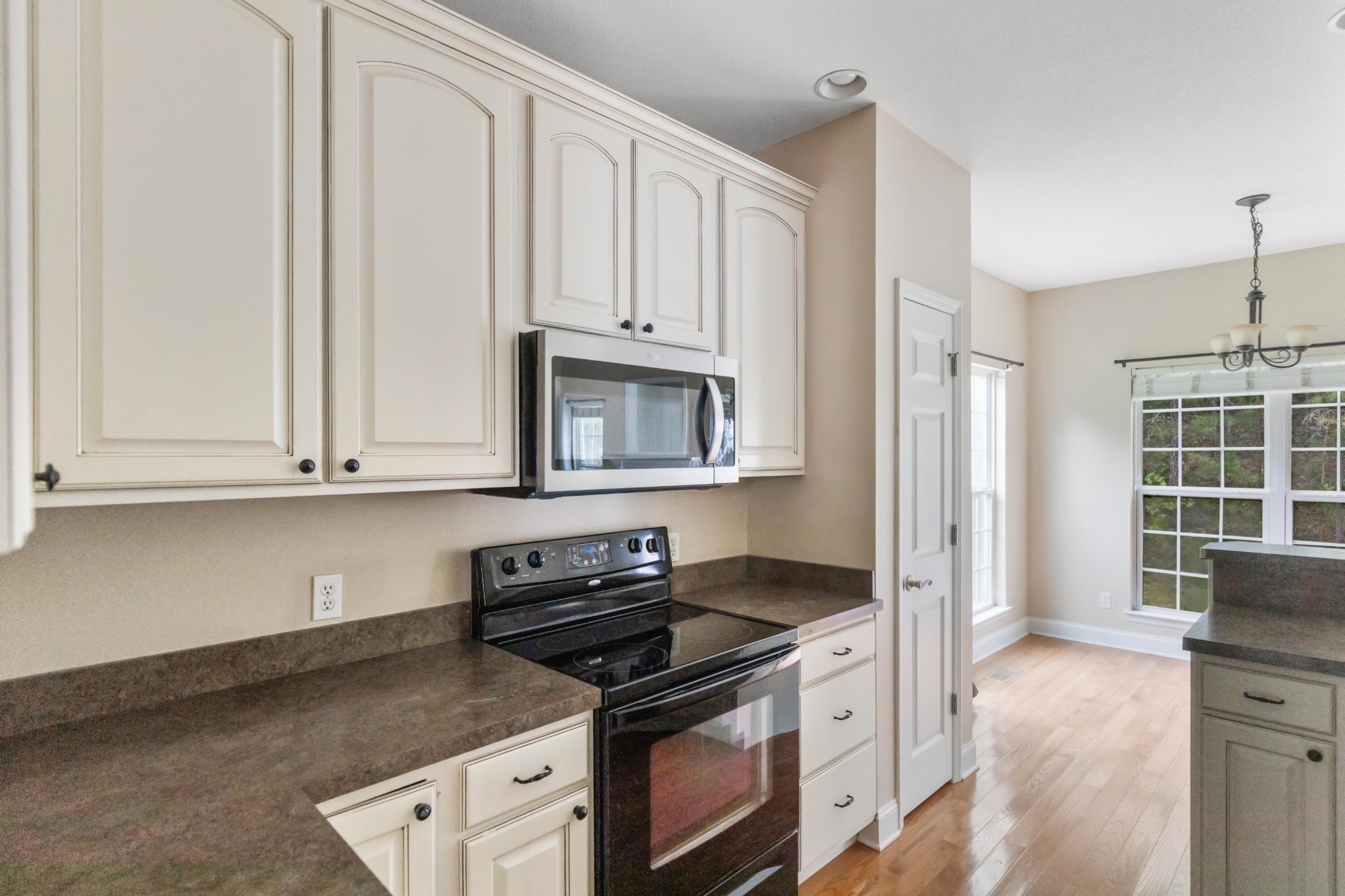2095 Baggett Road Ringgold, GA 30736 - Photo 22 of 34 a white kitchen with granite countertop stainless steel appliances