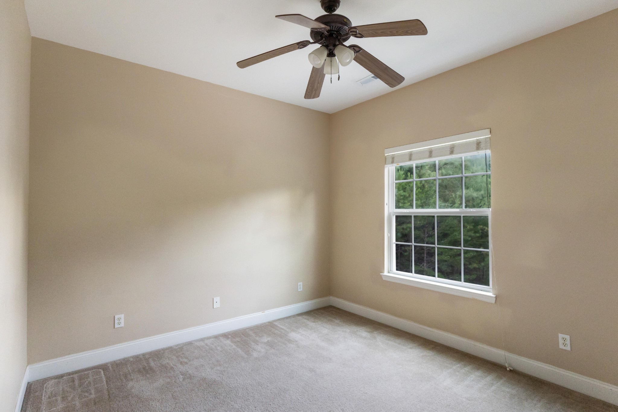 2095 Baggett Road Ringgold, GA 30736 - Photo 26 of 34 an empty room with a window and a fan