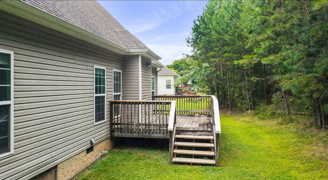 an aerial view of a house with a swimming pool and outdoor seating
