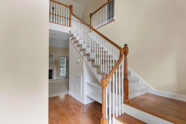 a view of entryway and hall with wooden floor
