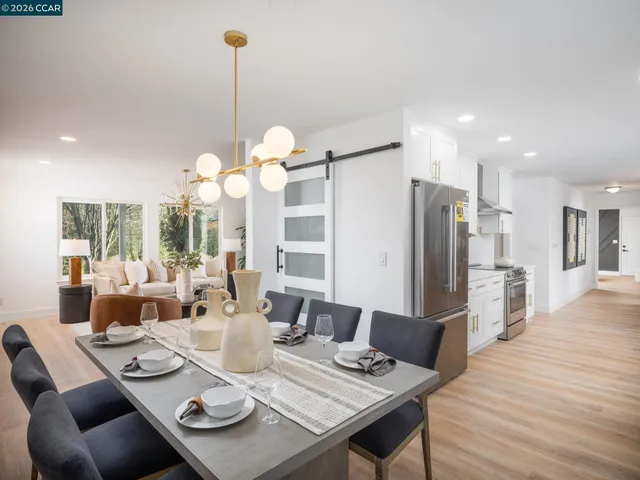 a stove top oven sitting inside of a kitchen