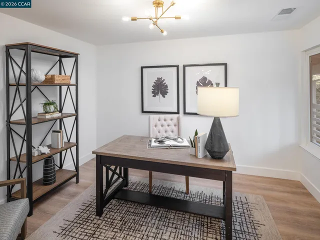 a spacious bathroom with a double vanity sink and a mirror