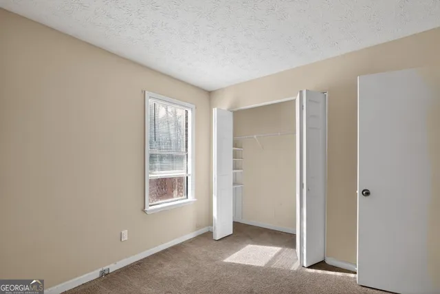 a view of an empty room with window