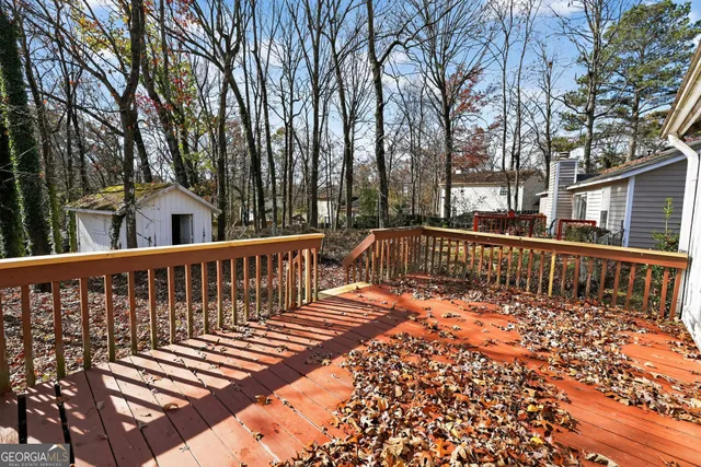 a view of deck with a large trees