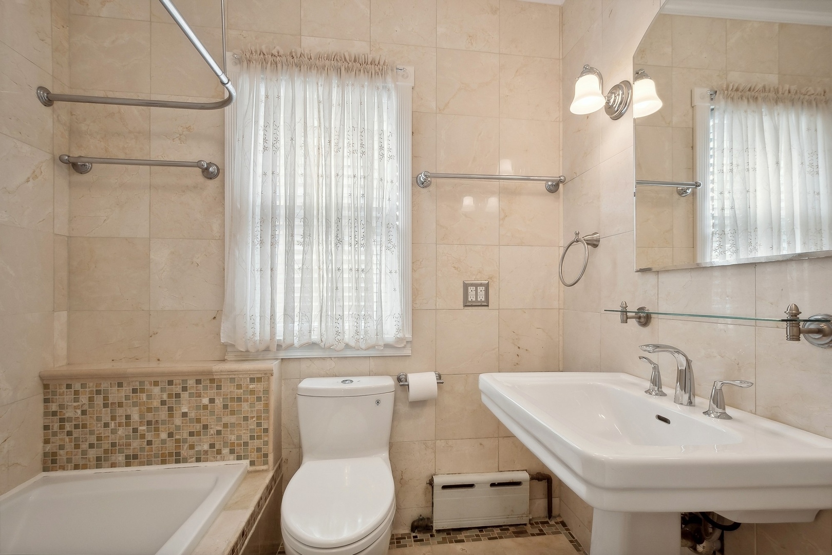 504 Maple Avenue Wilmette, IL 60091 - Photo 11 of 20 a bathroom with a sink a toilet and shower