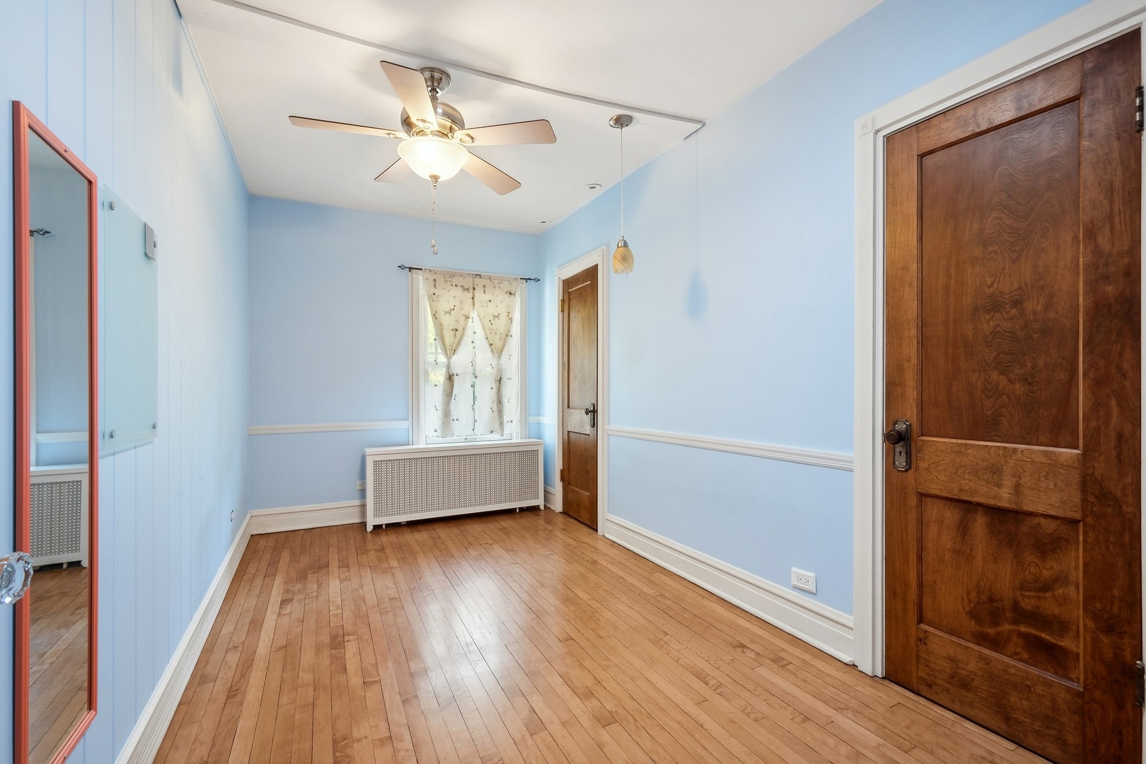 504 Maple Avenue Wilmette, IL 60091 - Photo 10 of 20 wooden floor in an empty room with a window