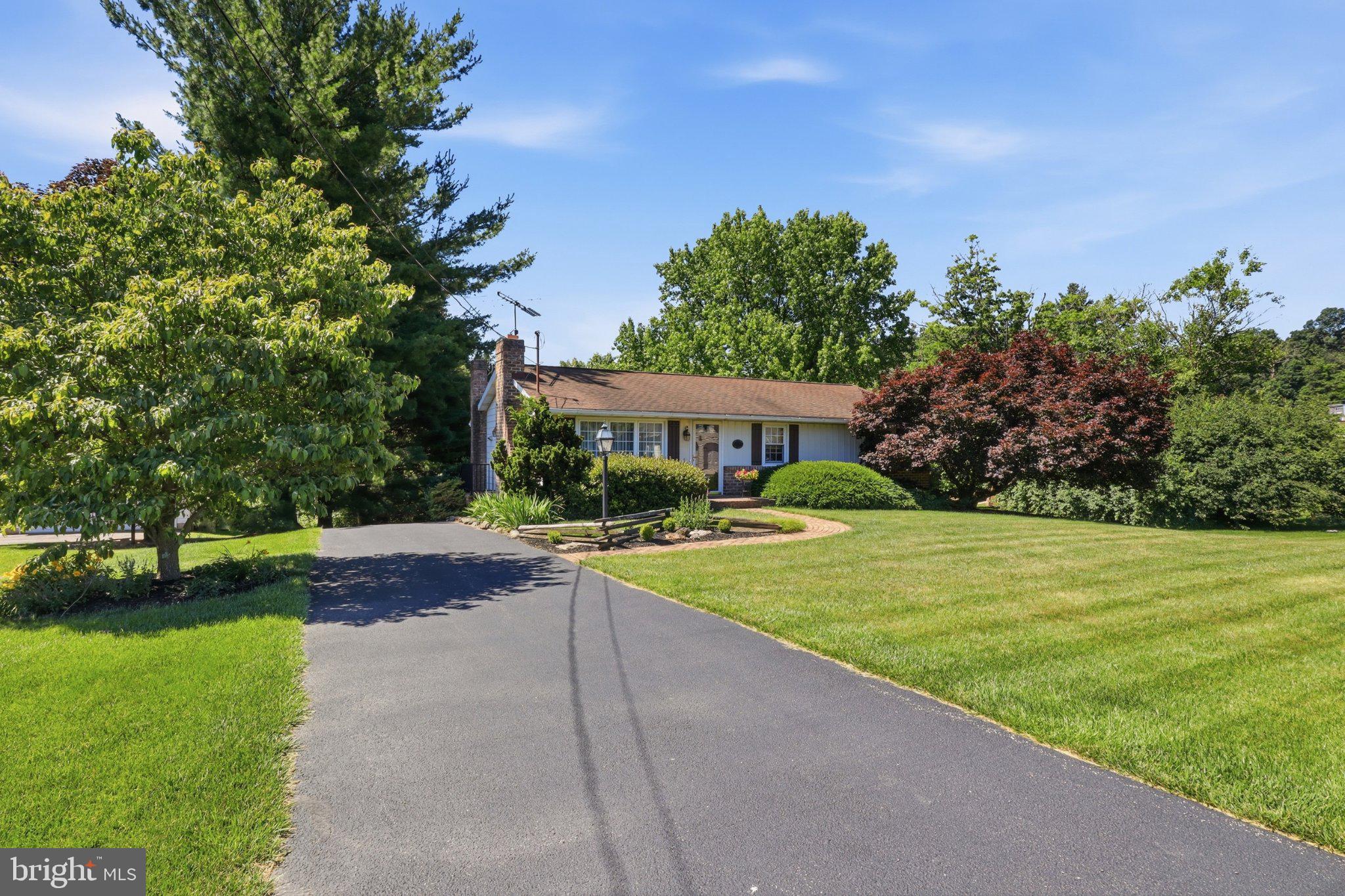 2381 Ridge Road Glenville, PA 17329 - Photo 2 of 58 Charming home with lush greenery.