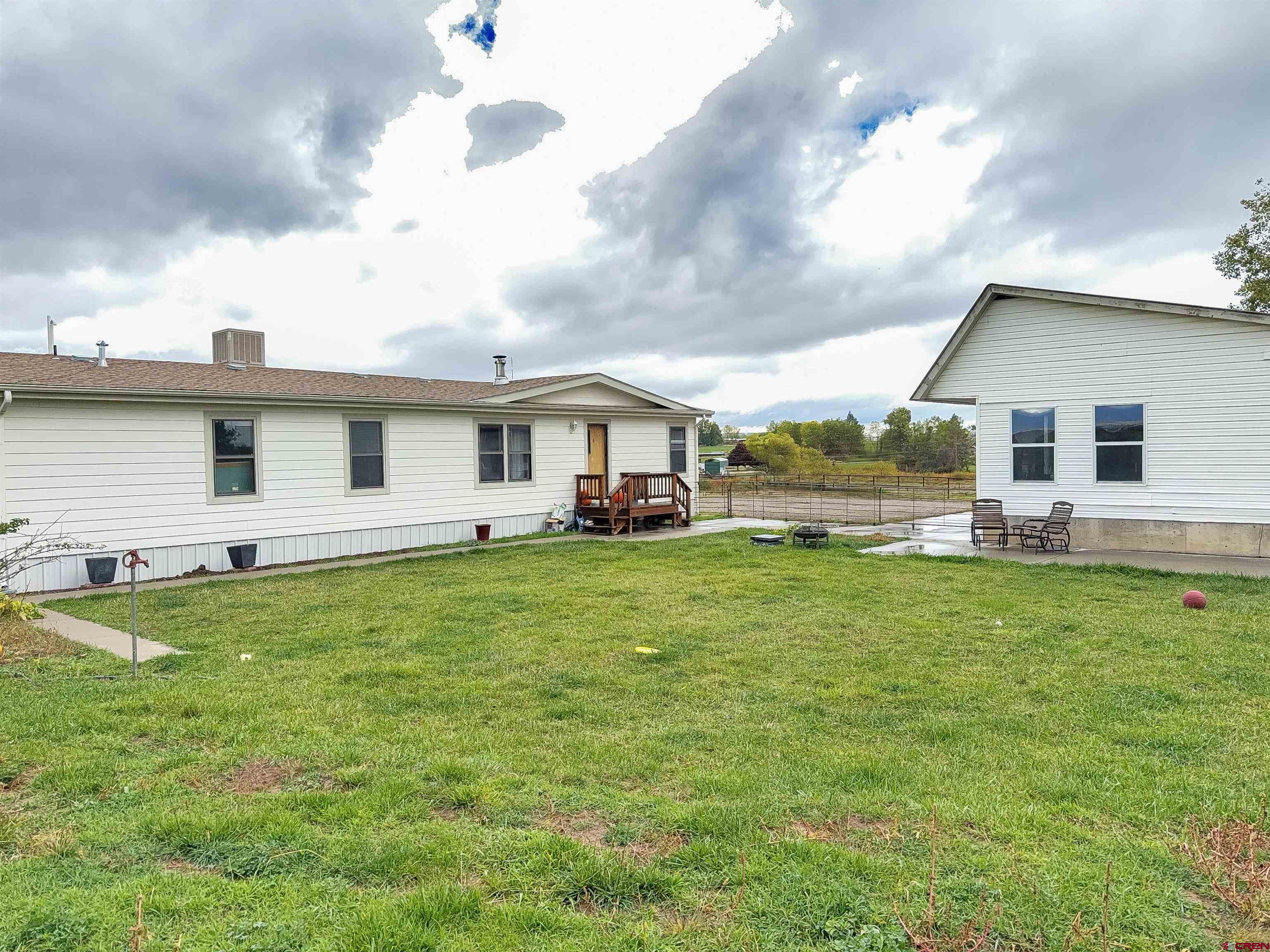 a front view of house with yard and seating area