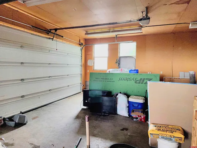 a view of a chair and table in the balcony