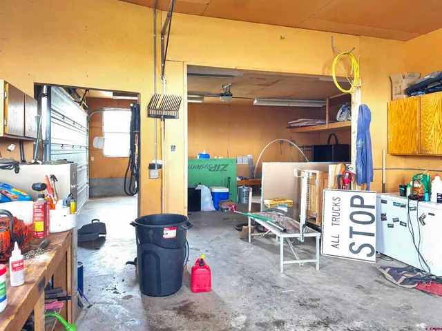 a view of a chairs and table in backyard