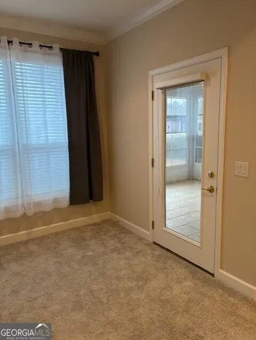an empty room with an entryway door