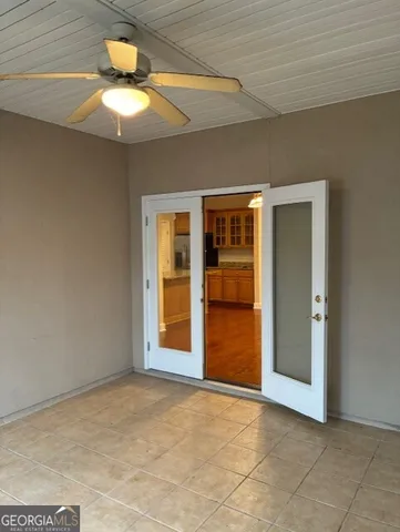 a view of an empty room with a chandelier