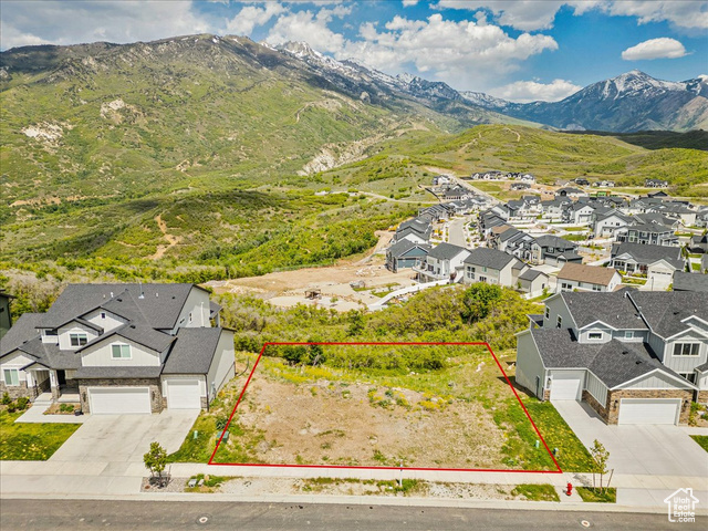 14673 South Ravine Rock Way East, Unit 720 Draper, UT 84020 - Photo 12 of 15 Aerial view of residential area featuring a mountain backdrop and property parcel outlined