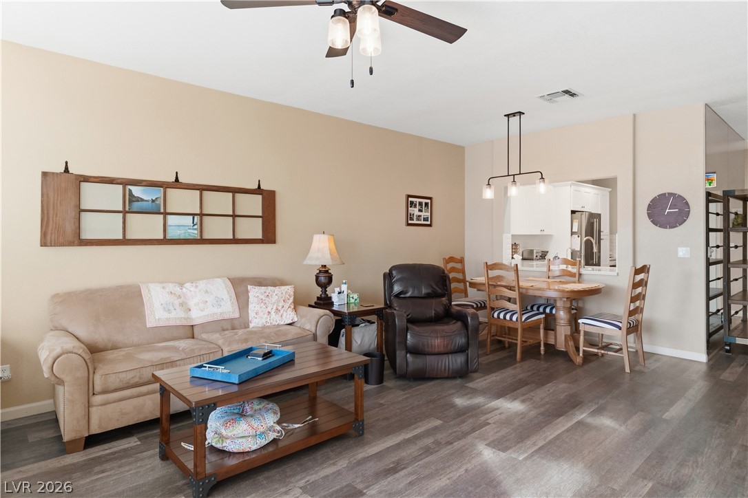 3350 Pheasant Canyon Way, Unit 1008 Laughlin, NV 89029 - Photo 8 of 80 Living room featuring ceiling fan and dark wood finished floors