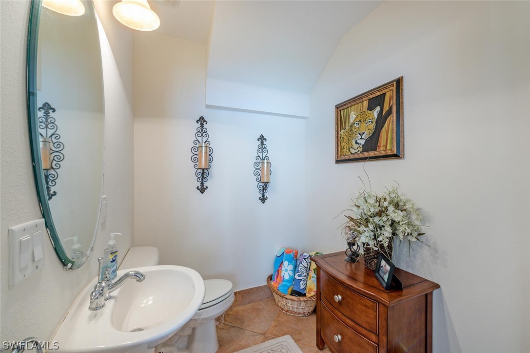 4032 Cherrybrook Loop Fort Myers, FL 33966 - Photo 11 of 22 a bathroom with a sink mirror and vanity