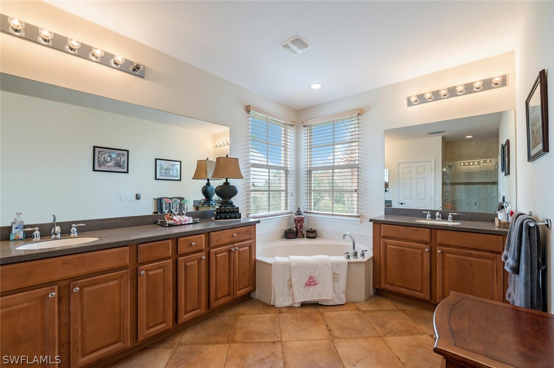 4032 Cherrybrook Loop Fort Myers, FL 33966 - Photo 15 of 22 a large kitchen with a sink and cabinets